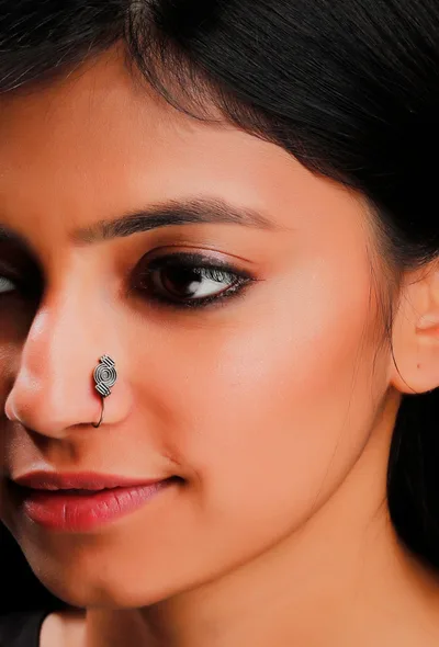 Intricate Brass Circular motif Nose Pin