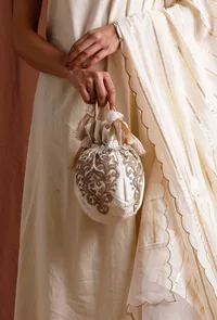 White Dupion Silk Potli with Gold Strings image 1